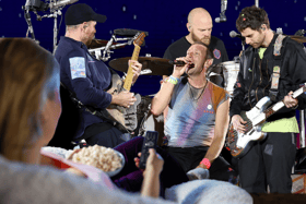 No need to shove, unless there's no room on the couch; for those who aren't heading to Glastonbury this week, there are plenty of other ways to follow the festival comprehensively without ruining your favourite pair of Hunters (Credit: Getty/Canva)