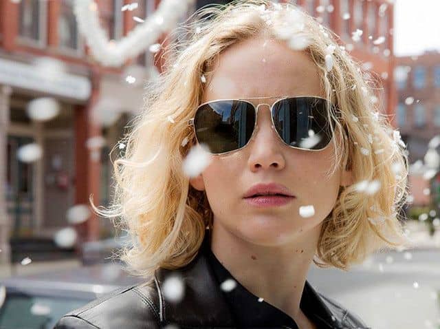 Jennifer Lawrence wearing gold-framed aviators in the movie Joy