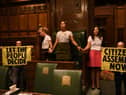 Handout photo taken with permission from the twitter feed of Extinction Rebellion of protesters who have superglued themselves around the Speaker's chair in the House of Commons chamber, as they call for a Citizen's Assembly. Picture date: Friday September 2, 2022.