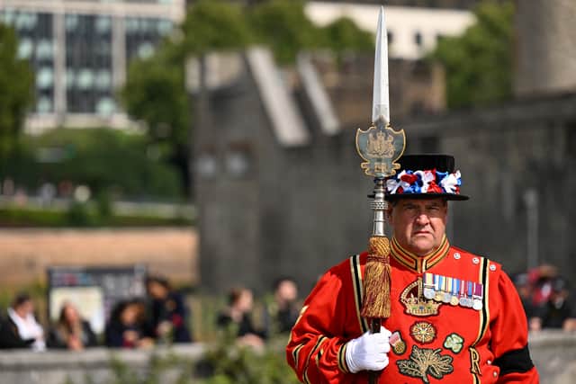 A Yeomen Warders stands guard for the Death Gun Salute fired at the Tower of London by the Honourable Artillery Company, British Army, taking place to mark the death of Queen Elizabeth II.