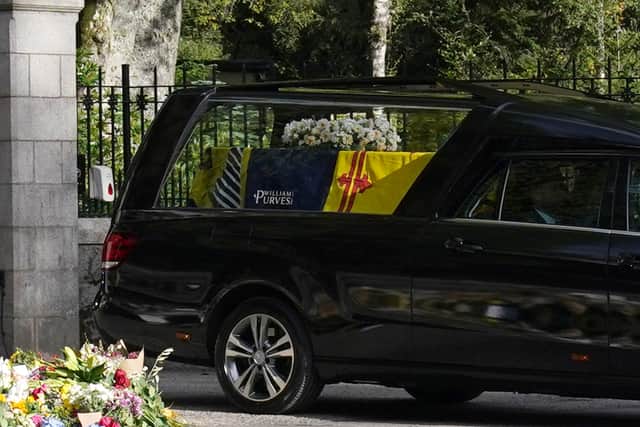 The hearse carrying the coffin of Queen Elizabeth II, draped with the Royal Standard of Scotland, leaving Balmoral as it begins its journey to Edinburgh. Picture date: Sunday September 11, 2022. (Photo: PA)