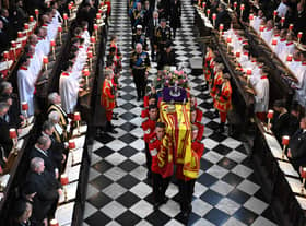 Soldiers of The Queen’s Company of the Grenadier Guards carry the coffin of Queen Elizabeth II
