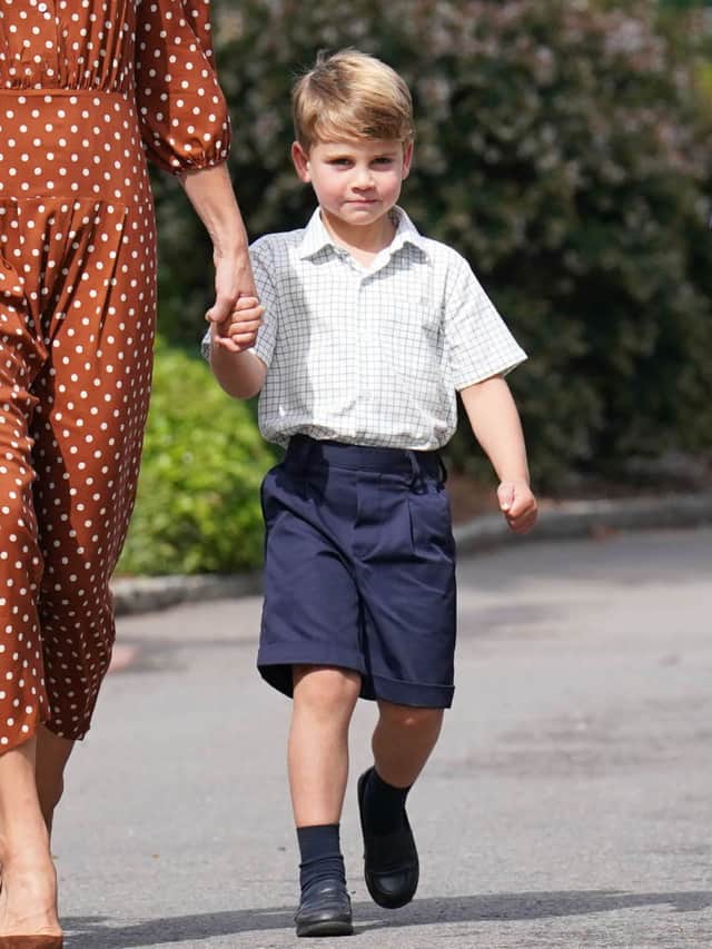 Prince Louis, accompanied by his parents the Prince and Princess of Wales.