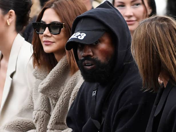 Kanye West attends the Givenchy Spring-Summer 2023 fashion show during the Paris Womenswear Fashion Week, in Paris, on 2 October 2022 (Photo: JULIEN DE ROSA/AFP via Getty Images)