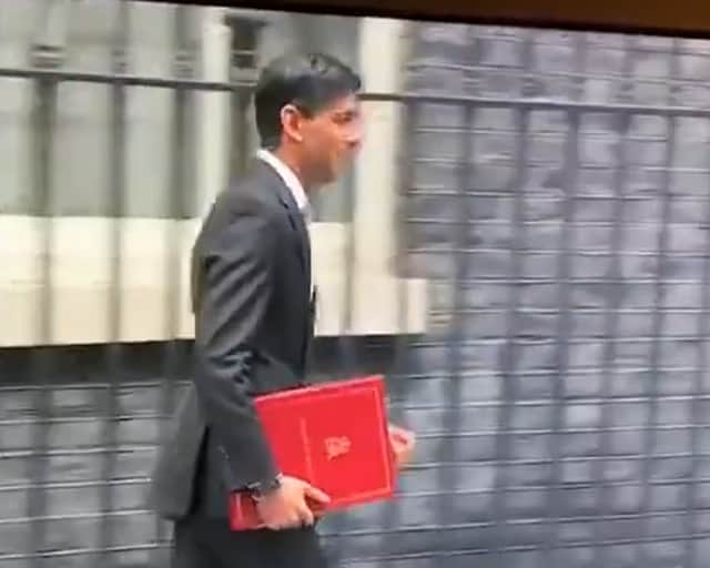 Rishi Sunak leaves Downing Street in 2020 with a burgundy coloured ring binder.