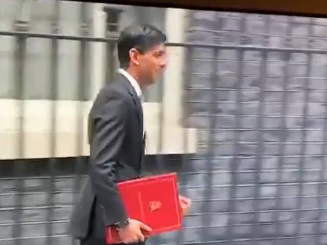 Rishi Sunak leaves Downing Street in 2020 with a burgundy coloured ring binder.