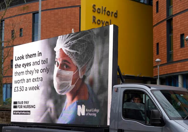 Responding to the government’s NHS pay proposal, the Royal College of Nursing has released a digital billboard message showing the image of a nurse in PPE with the message: ‘Look them in the eyes and tell them they’re only worth an extra £3.50 a week’ outside the Salford Royal hospital. 