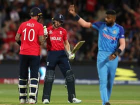 Alex Hales of England congratulates  Jos Buttler of England on his 50th run during the ICC Men's T20 World Cup Semi Final match between India and England at Adelaide Oval on November 10