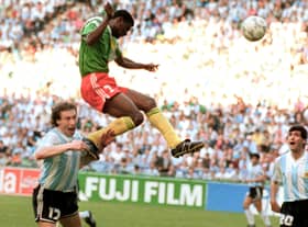 Forward Francois Omam-Biyick from Cameroon scores with a header as Argentinian defenders Nestor Lorenzo (L) and Juan Simon look on during the opening match of Italia 90  (STAFF/AFP via Getty Images)