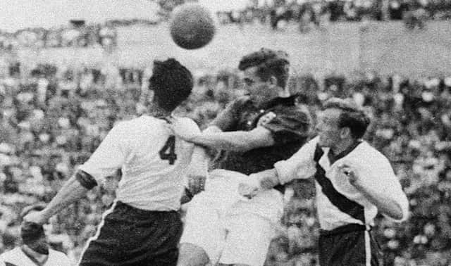 Tom Finney challenges with Charlie Colombo and Edward John McIlvenny during the World Cup first-round match between England and the United States in 1950 (Photo STAFF/AFP via Getty Images)
