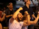 Football fans celebrate while watching the live broadcast of the final of the 2020 UEFA European Championships between England and Italy in the Oxford Arms pub in Camden on July 11, 2021 in London.