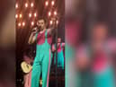 Video footage shows Harry Styles asking the crowd to move back slowly to stop fans being crushed against the handrails.