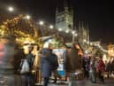 Christmas shoppers browse stalls at the traditional Christmas market in Bath.