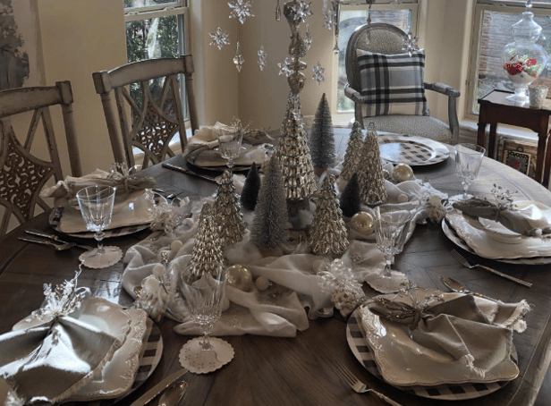 <p>An example of a ‘modern’ Christmas dinner tablescape in silver and white. Pic: @elleandmavenue on Instagram.</p>