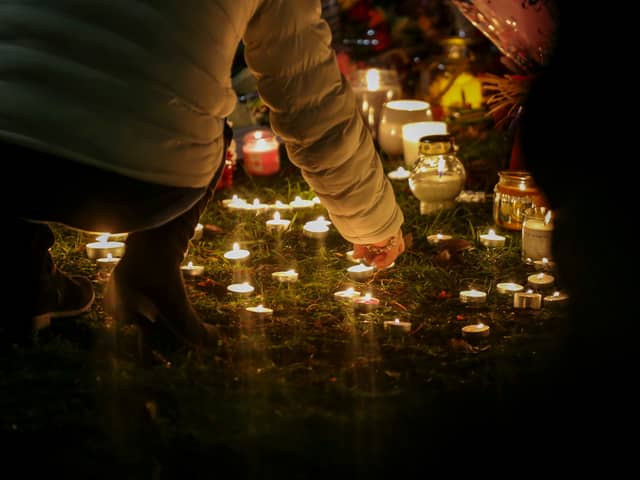 An organised candelit vigil at Babbs Mill Lake where a group of children fell through the ice on Sunday. Three of those children have died while a fourth, aged six, is fighting for his life in hospital.