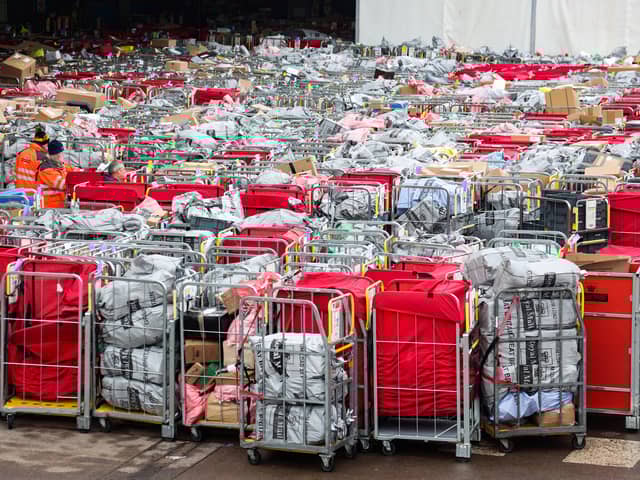 Letter and parcels pile up outside the Royal Mail centre in Bristol. Due to the postal strike along with the busy festive period lots of cages are seen outside the mail centre. Many of these parcels have been left outside for at least 17 hours.
