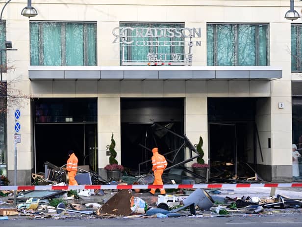 Berlin’s AquaDom aquarium containing 1,500 tropical fish bursts causing major flooding on nearby streets.