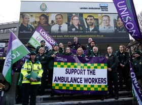 Christina McAnea, general secretary of UNISON, poses with ambulance workers at a picket line outside the Waterloo ambulance station in London on December 21, 2022. - Striking UK ambulance workers took to the picket lines, escalating a dispute with the government over its refusal to increase pay above inflation after recent walkouts by nurses. (Photo by Niklas HALLE’N / AFP) (Photo by NIKLAS HALLE’N/AFP via Getty Images)