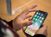 iPhone users could save hundreds of pounds using this clever trick (Photo by Carl Court/Getty Images).