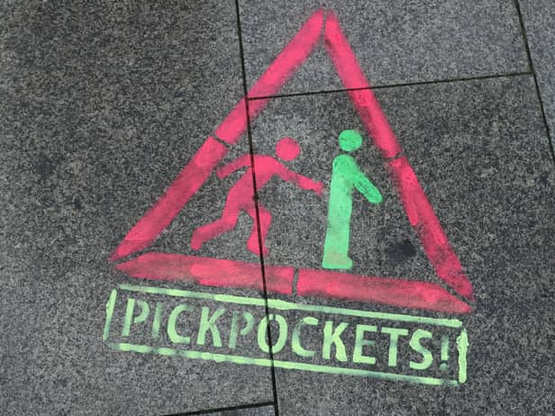 Major travel scams and how to avoid in 2023 including pickpockets, fake COVID tests, and unlicensed taxi firms