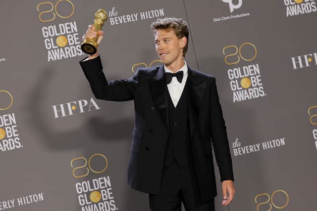 Austin Butler poses with the Best Actor in a Motion Picture â Drama award for "Elvis"