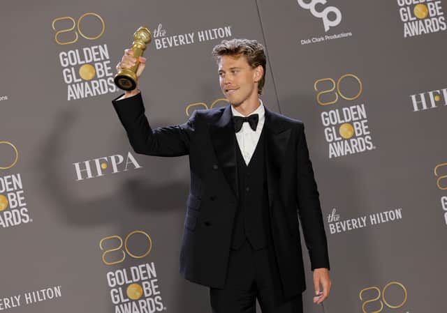 Austin Butler poses with the Best Actor in a Motion Picture â Drama award for "Elvis"