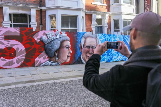 The street art was erected on hoardings in Northampton town centre to mark the beginning of the reign of King Charles III following the death of The Queen.   