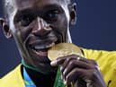 Gold medalist Usain Bolt of Jamaica stands on the podium during the medal ceremony for the Men’s 4 x 100 meter Relay on Day 15 of the Rio 2016 Olympic Games at the Olympic Stadium on August 20, 2016 in Rio de Janeiro, Brazil.  (Photo by Patrick Smith/Getty Images)