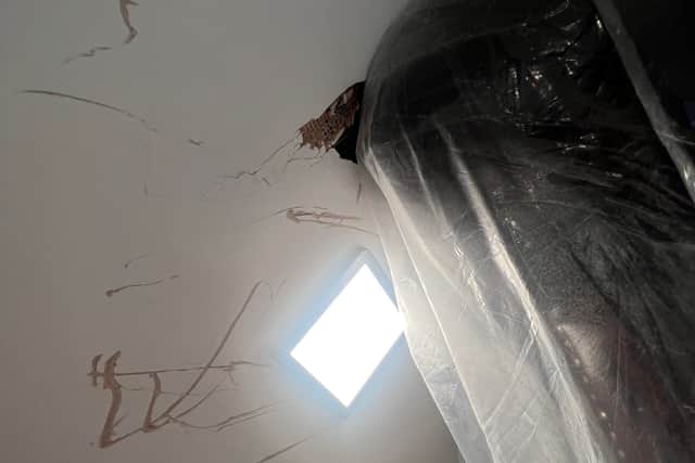 The sofa stuck on the stairs. See SWNS story SWLNsofa. A homeowner has slammed a furniture company after they abandoned a failed attempt to deliver new sofa - leaving it jammed on the stairs. Luke Ansell, 27, had just moved in to his brand new £500k home in Bournemouth in December when he bought an over £2,000 sofa that was delivered on January 19. Despite delivery-men assuring him that they made tight deliveries 'all the time' - the pair from designersofasforyou.co.uk failed to get the new sofa-bed up a narrow staircase, before abandoning it. Photos of the shocking attempted delivery show how the pair left huge holes in the staircase plasterwork, and damage to the woodwork, before leaving.