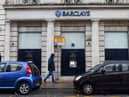A man walks past a Barclays bank, in the Channel island's port capital Saint Helier, on December 11, 2022. (Photo by Sebastien SALOM-GOMIS / AFP) (Photo by SEBASTIEN SALOM-GOMIS/AFP via Getty Images)
