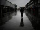 Dismal weather heralds the arrival of the UK Chancellor’s Autumn Statement as people shop in the centre of Bolton.