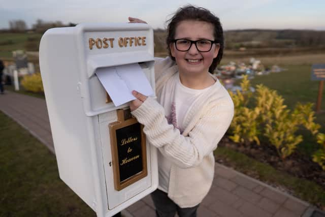 Matilda Handy, 9, and mum, Leanne Handy 45 with their letter box to heaven, in Gedling Crematorium, which allows grieving members of the public to write a letter to their loved ones who have passed away.  (Picture credit by SWNS)