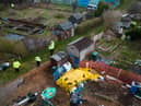 A police search team works through an allotment area as they continue to search for the missing baby in Brighton (Photo by Leon Neal/Getty Images).