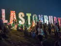Festival-goers enjoy the atmosphere prior to the 2013 Glastonbury Festival at Worthy Farm. (Photo by Ian Gavan/Getty Images)