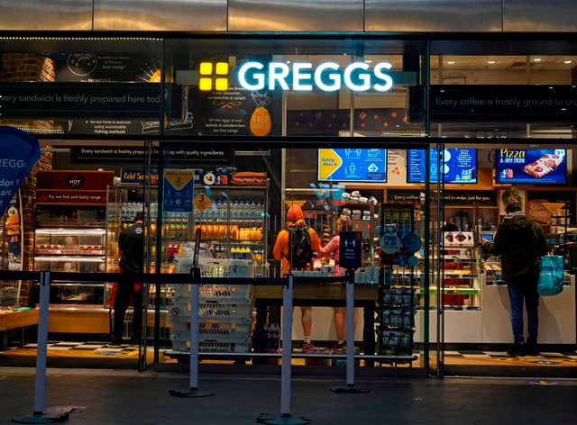 People purchase food in a branch of the bakery chain Greggs inside London Bridge station.