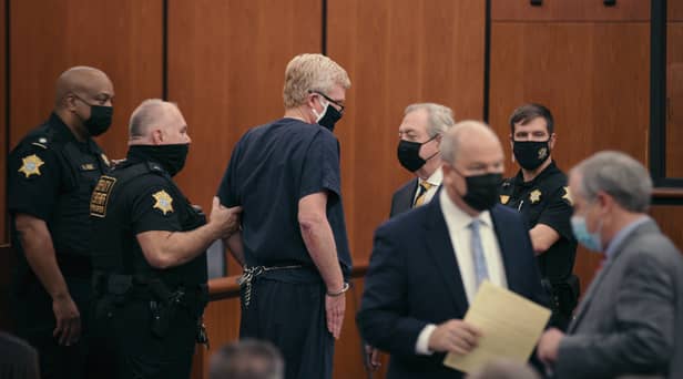 Disgraced former US lawyer Alex Murdaugh (centre) was convicted of the murder of his wife and son. (Photo: courtesy of Netflix)