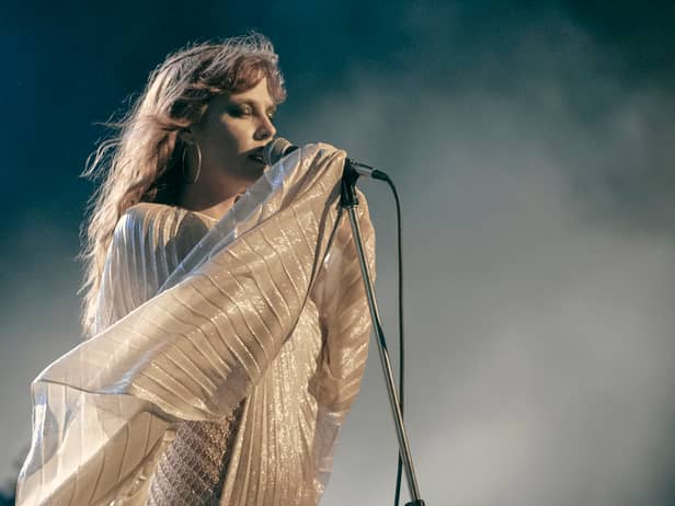 Riley Keough as Daisy Jones in Daisy Jones & The Six, performing in a style reminiscent of Stevie Nicks (Credit: Lacey Terrell/Prime Video)