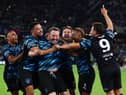 Lee Mack celebrates his goal with World XI teammates including Steven Bartlett (left-centre)