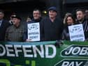 RMT general secretary Mick Lynch (centre) on an RMT picket line during January’s strike (Photo by DANIEL LEAL/AFP via Getty Images)