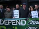 RMT general secretary Mick Lynch (centre) on an RMT picket line during January’s strike (Photo by DANIEL LEAL/AFP via Getty Images)