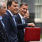 Britain’s Chancellor of the Exchequer Jeremy Hunt poses with the red Budget Box as he leaves 11 Downing Street in central London on March 15, 2023, to present the government’s annual budget to Parliament. (Photo by JUSTIN TALLIS / AFP) (Photo by JUSTIN TALLIS/AFP via Getty Images)