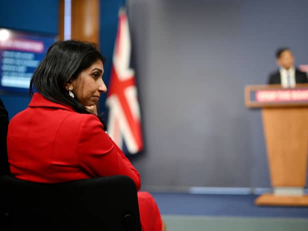 Suella Braverman listens on as prime minister Rishi Sunak announces the Illegal Migration Bill