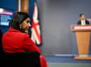 Suella Braverman listens on as prime minister Rishi Sunak announces the Illegal Migration Bill