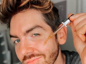 Scott McGlynn applying a serum.
