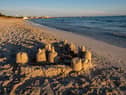 Strict beach laws in Benidorm could see visitors fined £130 for building a sandcastle (Photo: Adobe)