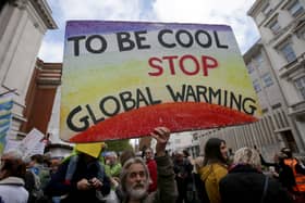 Scientists and science enthusiasts gather prior to the start of the 'March for Science' which celebrates the scientific method outside the Science Museum in central London on April 22, 2017, Earth Day