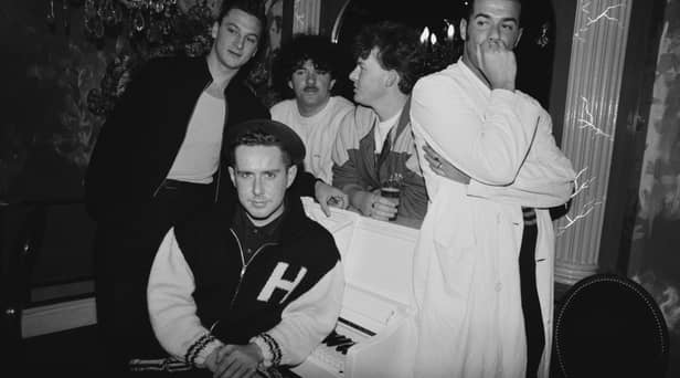 Frankie Goes To Hollywood in 1986. Singer Holly Johnson is seated by the piano, and behind him are (left to right) bassist Mark O’Toole, drummer Peter Gill, guitarist Brian Nash and singer Paul Rutherford. 