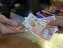 The first instalment of the £900 cost of living payments is set to land in bank accounts today. The £301 cash boost from the Department for Work and Pensions (DWP) and HMRC will be paid to those who are eligible over the next few weeks from Tuesday, April 25.