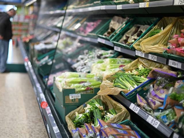 A shopper browses for fruit and vegetables in a Tesco supermarket in London on December 14, 2020 (Getty Images)