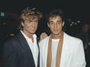 Singers George Michael (left) and Andrew Ridgeley of pop duo Wham!, at the premiere of the film 'Dune', London, England, 1984. (Photo by Fox Photos/Hulton Archive/Getty Images)